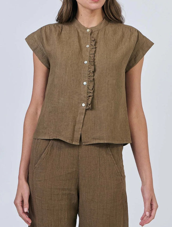 Brown top with ruffled details and matching pants on a plain background
