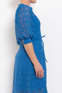 Blue lace dress with a plain white background